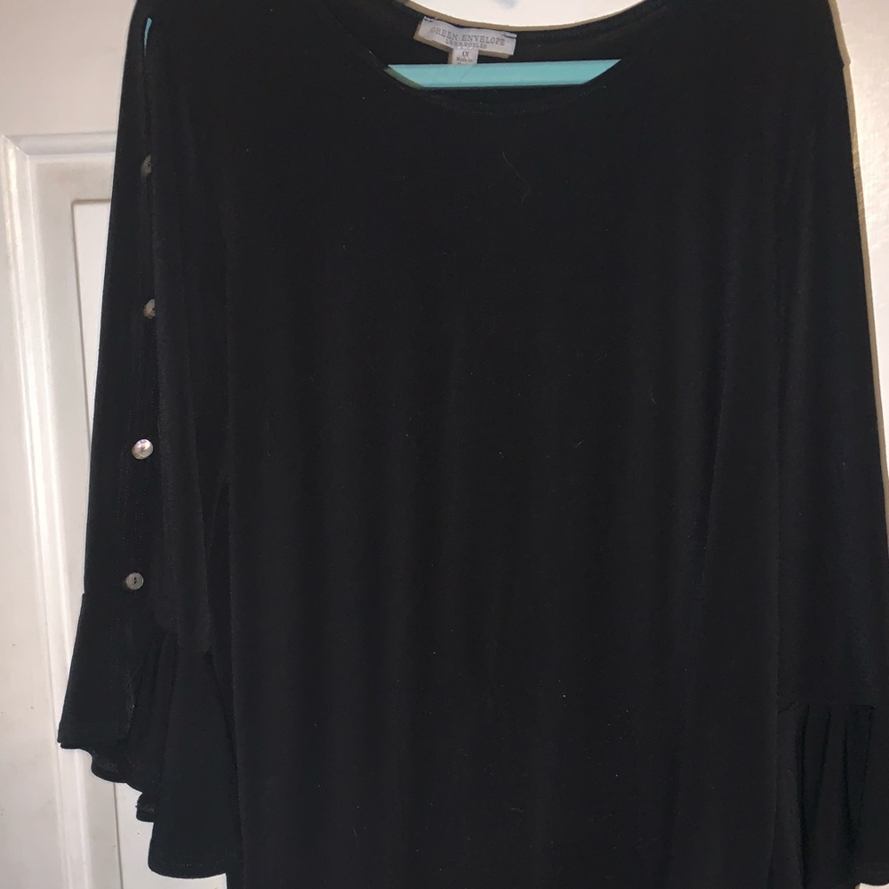 Black peekaboo arms blouse.